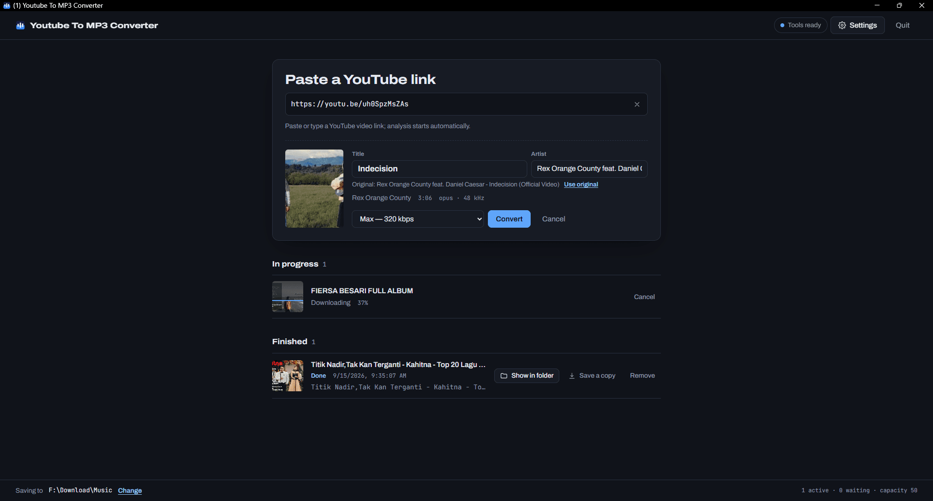 YouTube to MP3 & MP4 desktop app, showing the conversion screen and its job queue